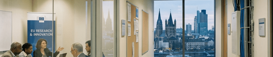 EU research and innovation meeting beside a corridor overlooking a city skyline